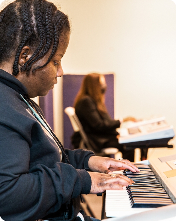 A DMF participant plays the piano