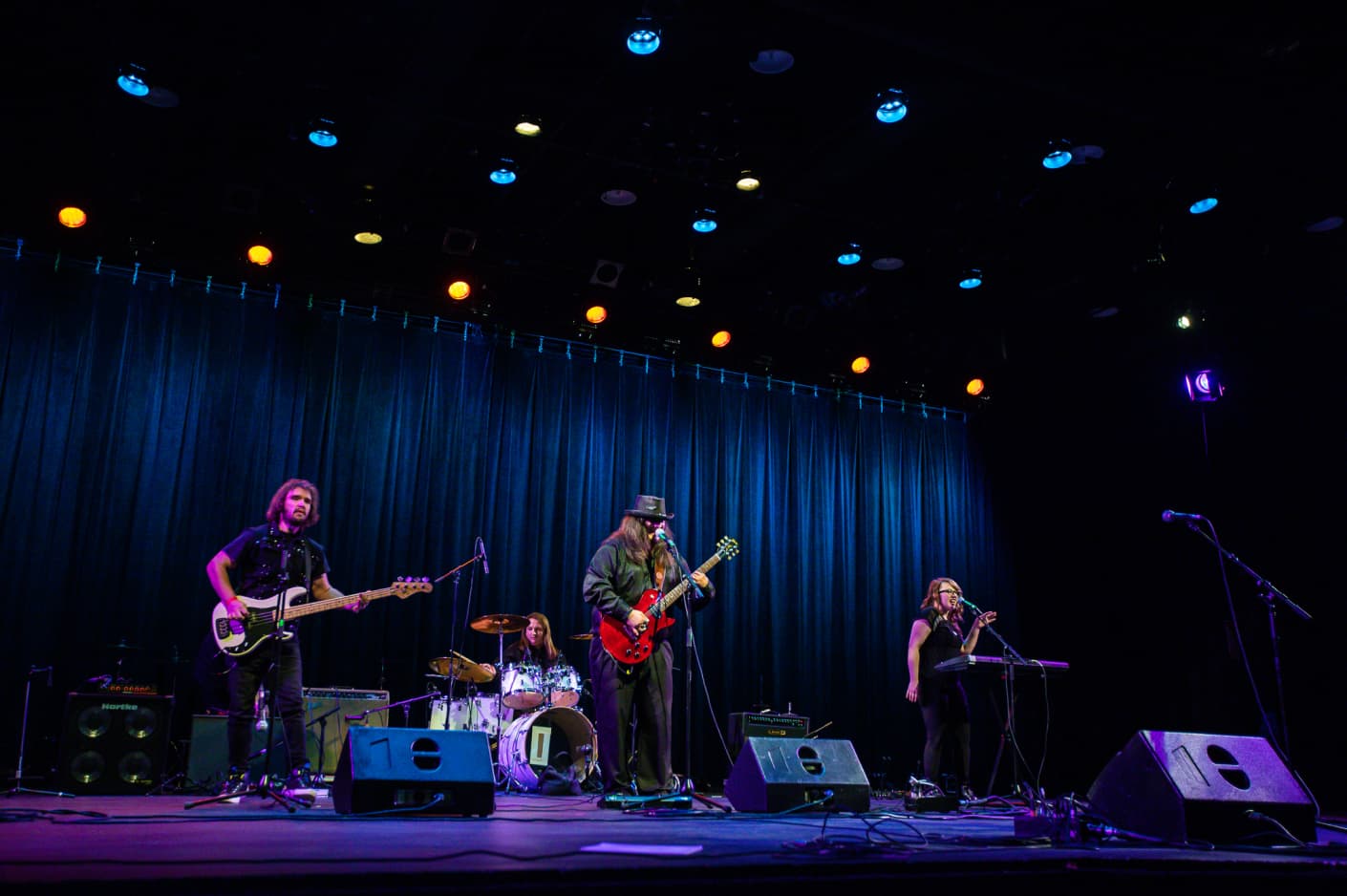 Danny Award recipient Gyorgi sings and plays the guitar with a drummer and a bass player