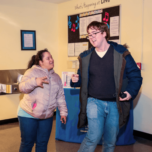 Photo of two members talking