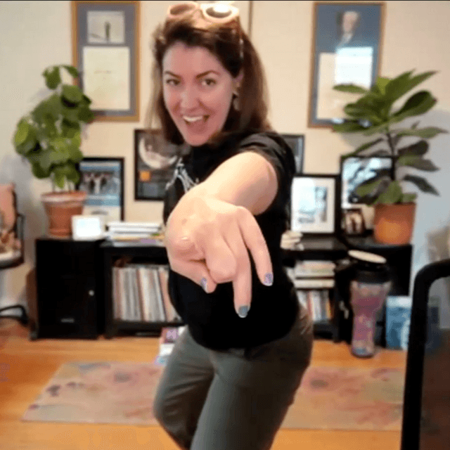 Photo of Jen Dancing and Pointing during an online event