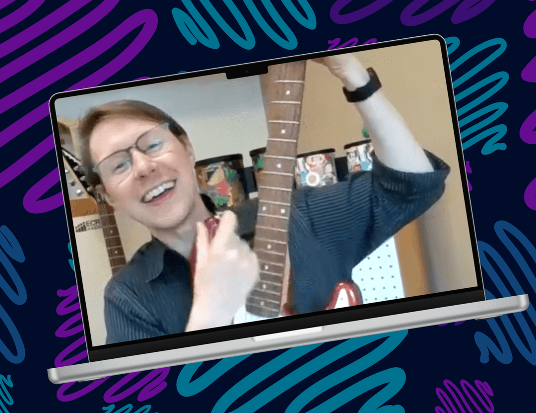 Photo of David with a guitar, framed within a laptop