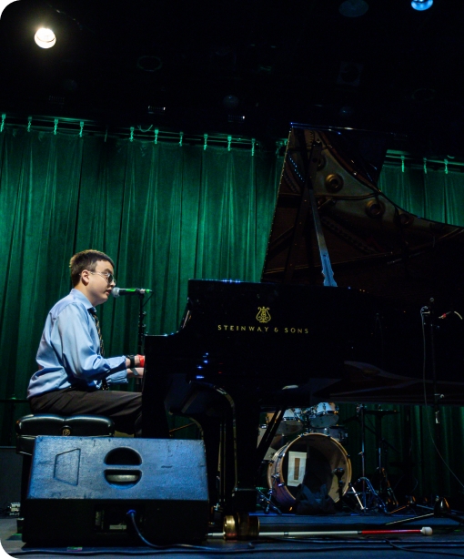 Danny Award recipient Devin Gutierrez plays the piano on stage