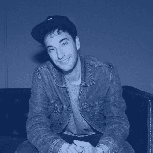Photo of Scott, a young light skinned man in a denim jacket and a baseball cap