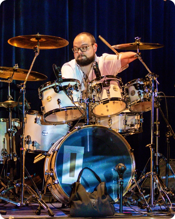 Danny Award recipient Cornel Hrisca-Munn plays the drums on stage