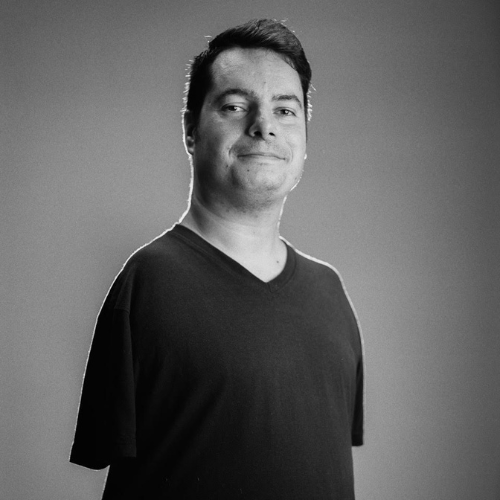 Photo of George Dennehy. A young white man with straight brown hair. He does not have arms.